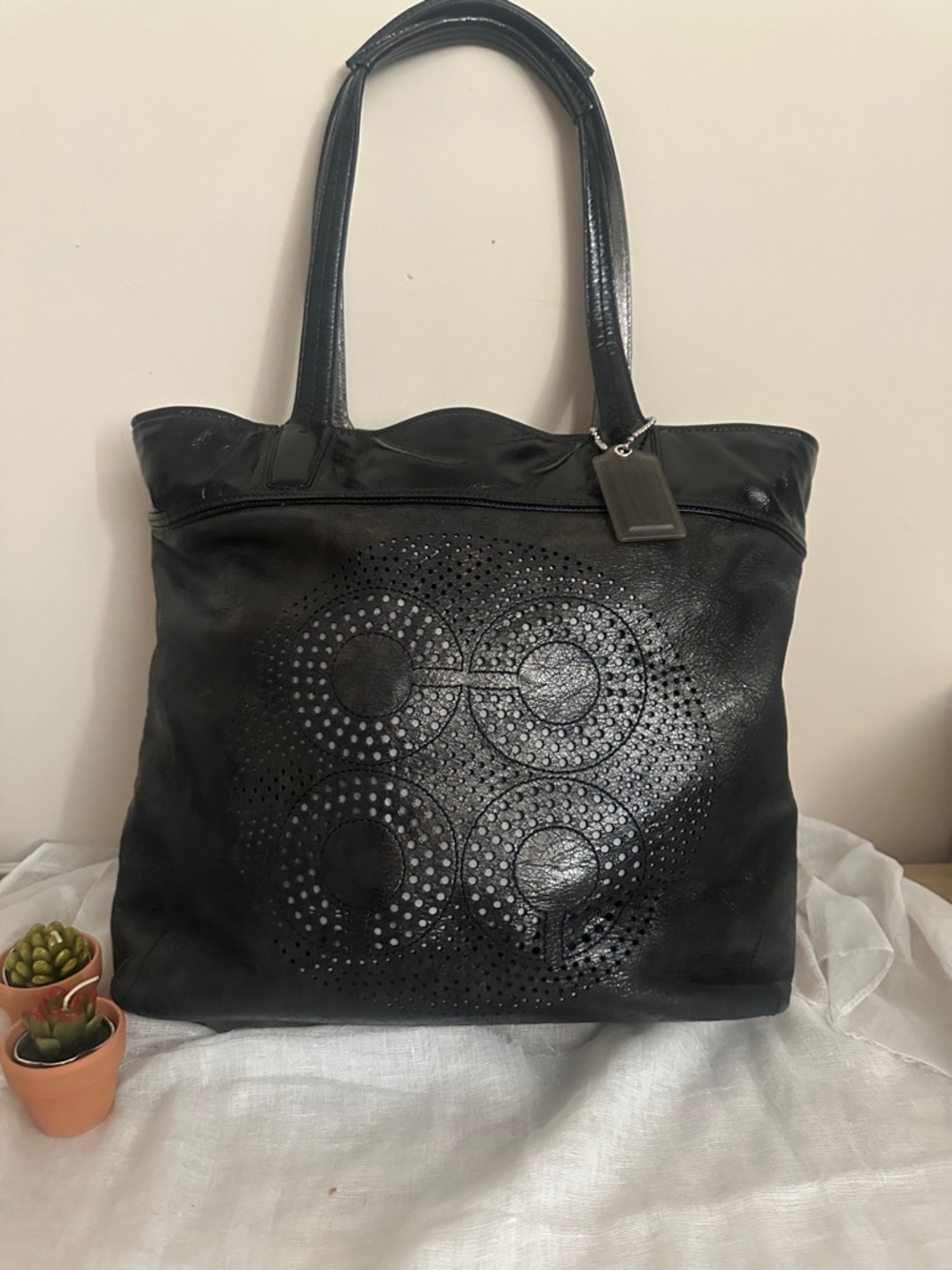 Coach Audrey Black Leather Tote with Perforated Circle Motif & Acrylic Bag Charm